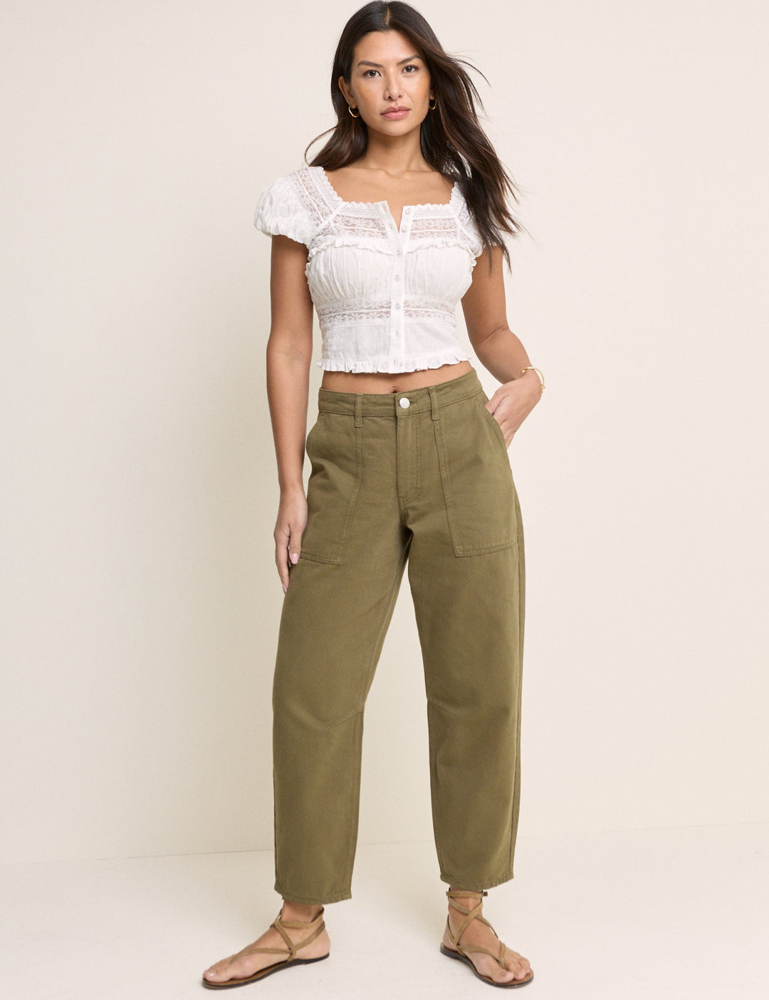 Women's khaki cropped utility trousers with straight legs and patch pockets