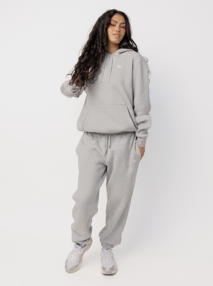 Women's grey jogger pants with logo detail, drawstring waist, side pockets and cuffed hems