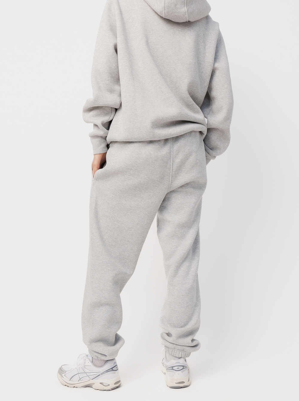 Women's grey jogger pants with logo detail, drawstring waist, side pockets and cuffed hems