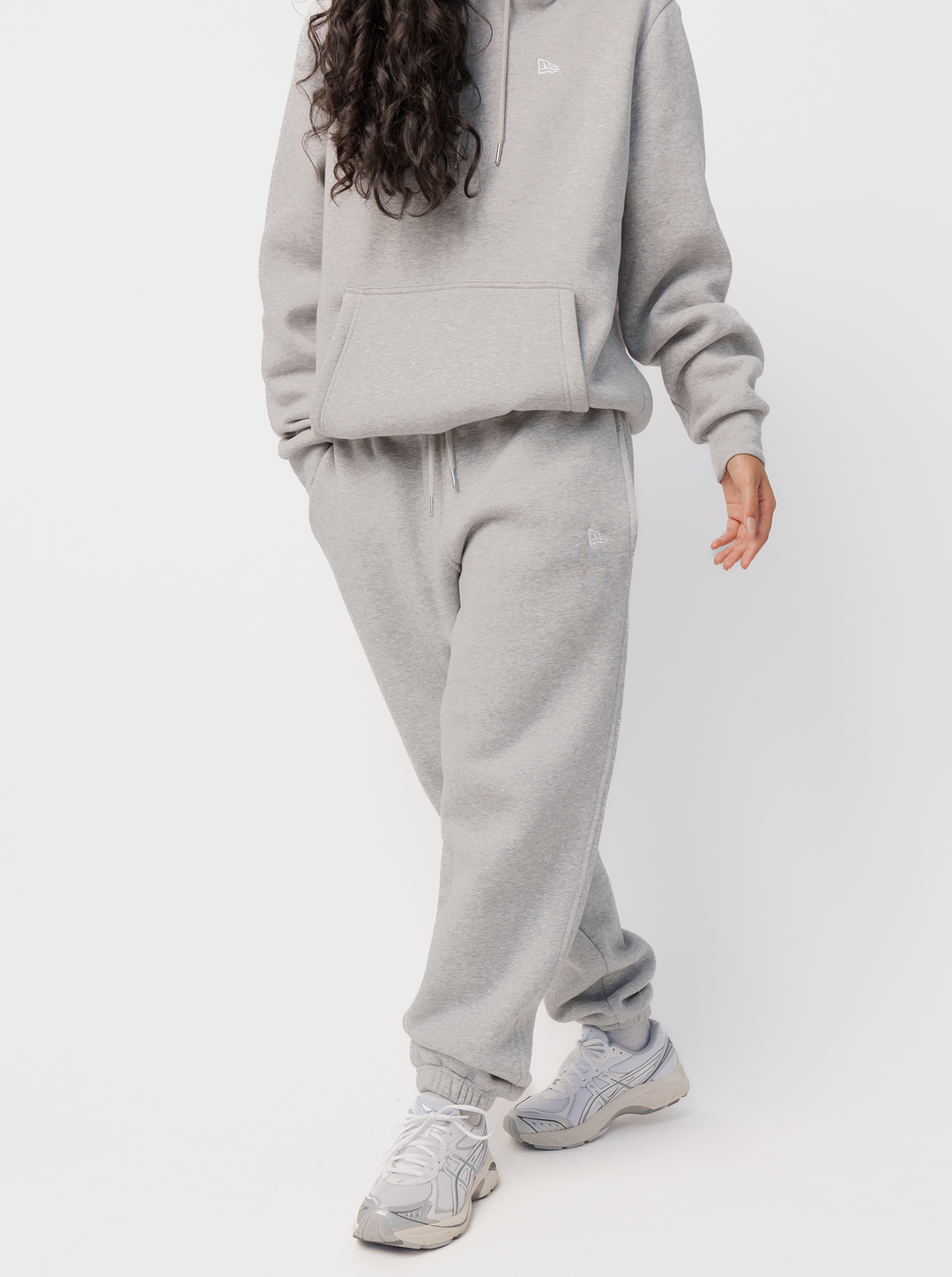 Women's grey jogger pants with logo detail, drawstring waist, side pockets and cuffed hems