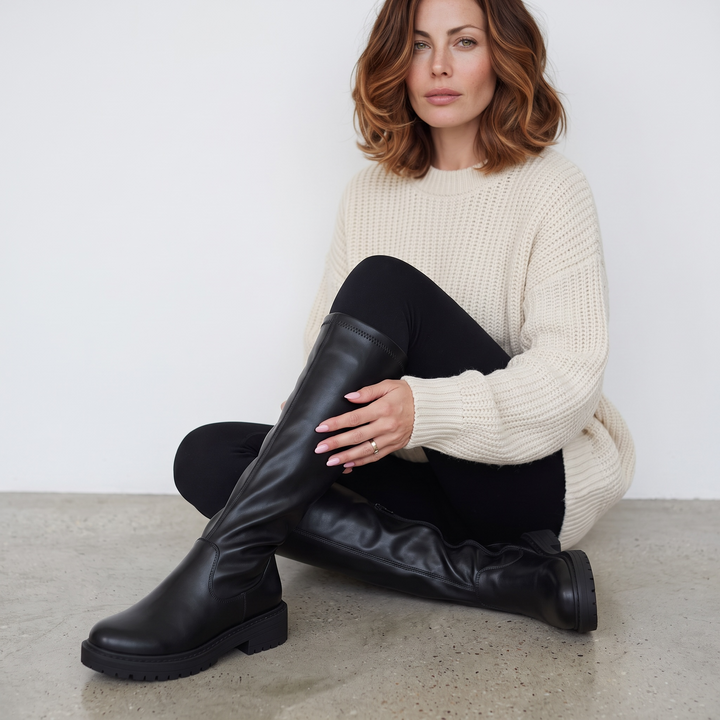 Women's black knee-high boots with round toes, side zippers and low block heels