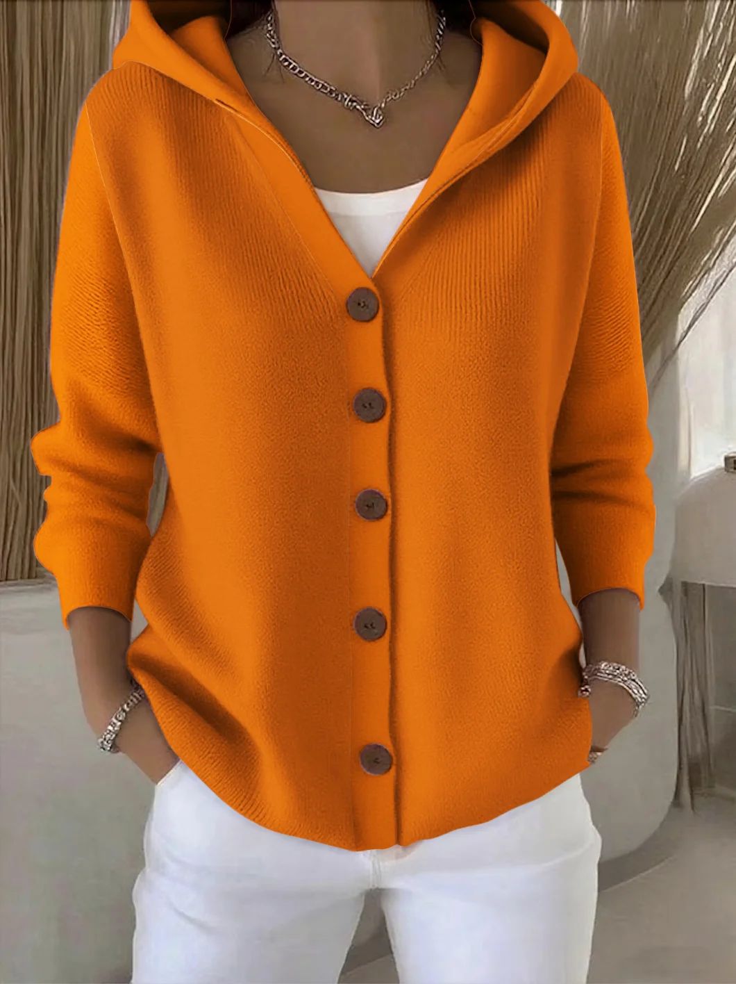Women's hooded cardigan with long sleeves and contrasting front buttons