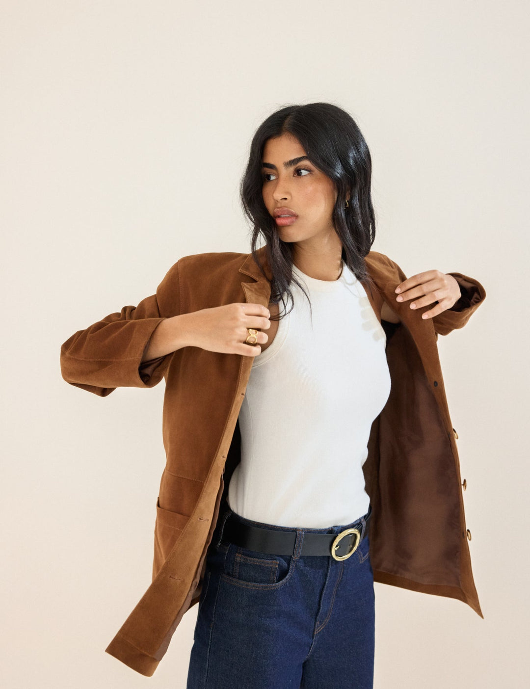 Women's brown blazer jacket with notched lapels, buttons and patch pockets