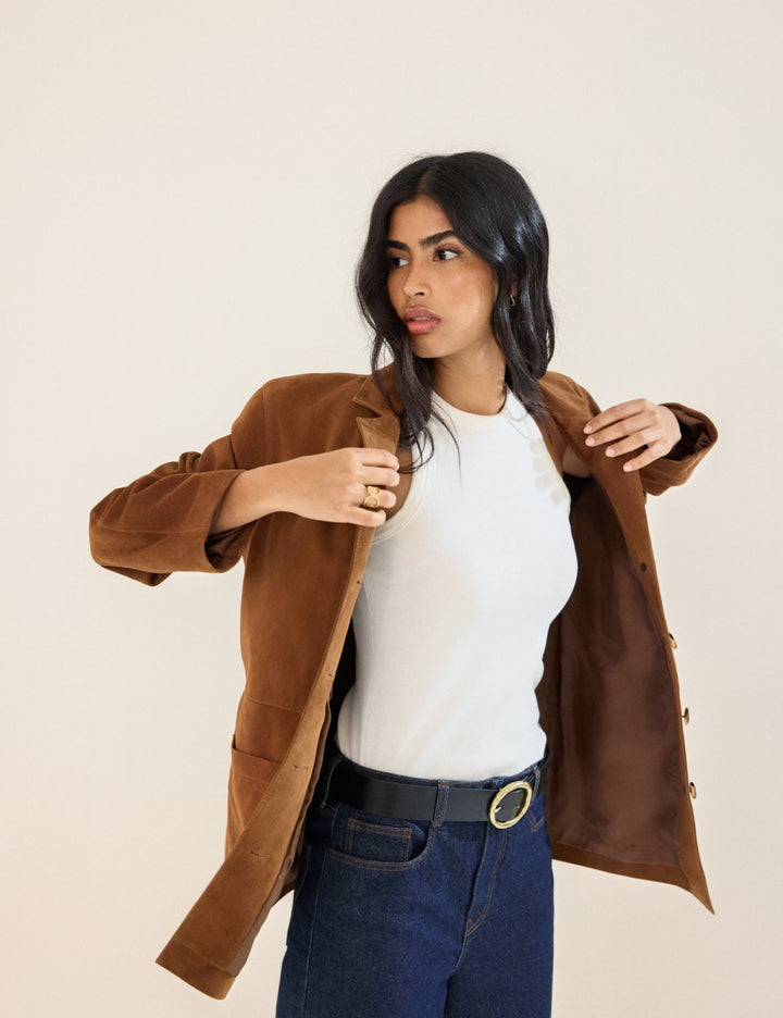Women's brown blazer jacket with notched lapels, buttons and patch pockets