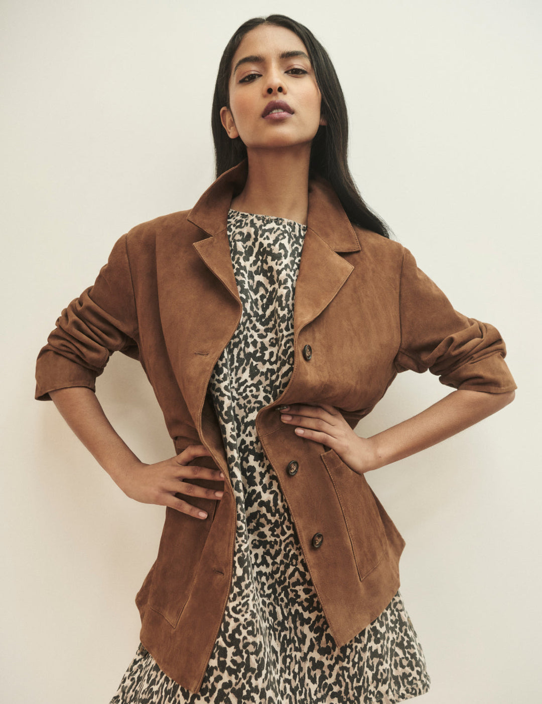 Women's brown blazer jacket with notched lapels, buttons and patch pockets