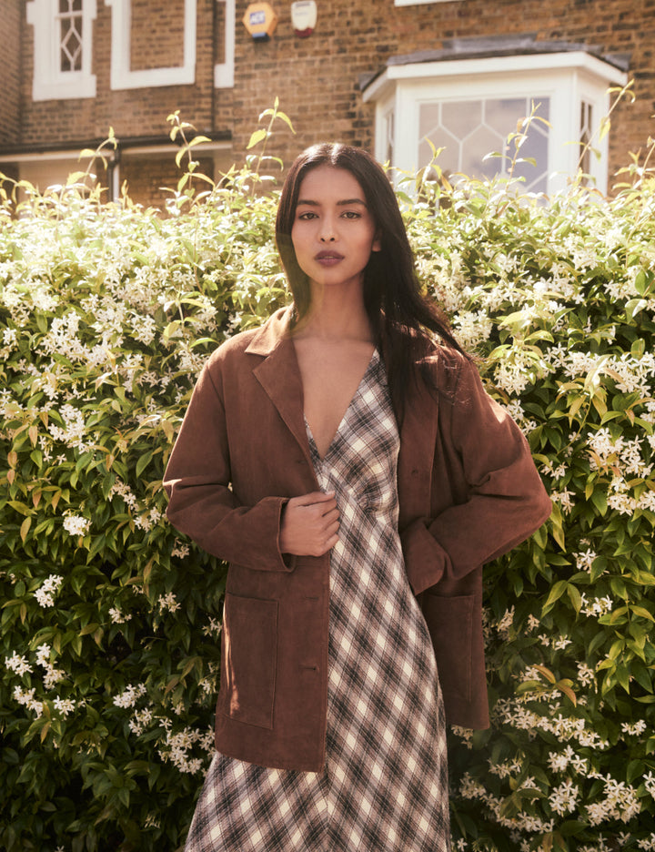 Women's brown blazer jacket with notched lapels, buttons and patch pockets