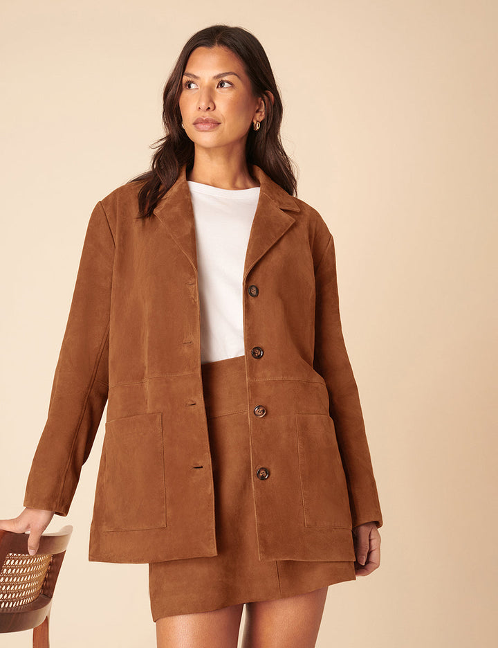 Women's brown blazer jacket with notched lapels, buttons and patch pockets