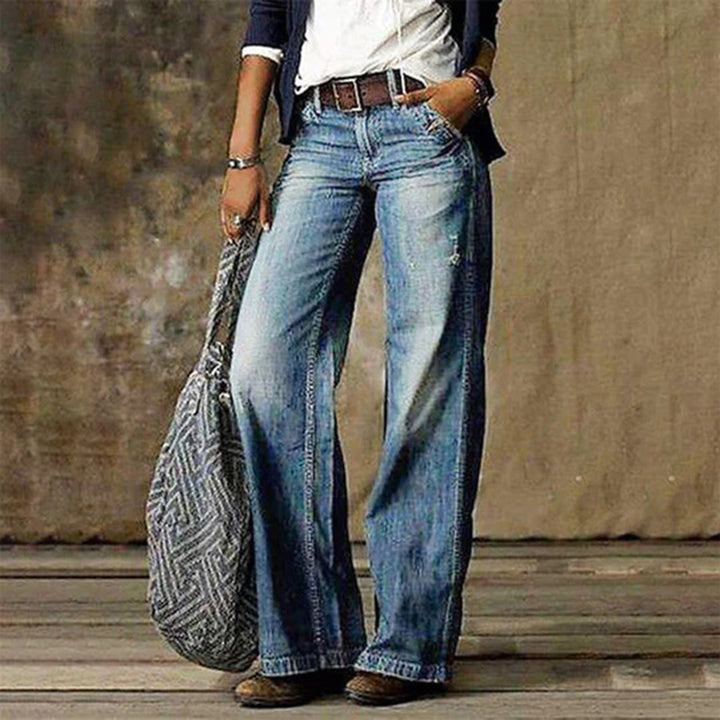 Women's high-waisted wide-leg jeans with faded denim finish
