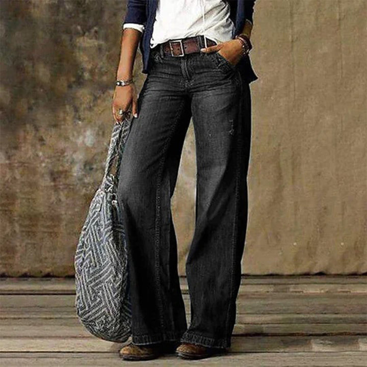 Women's high-waisted wide-leg jeans with faded denim finish