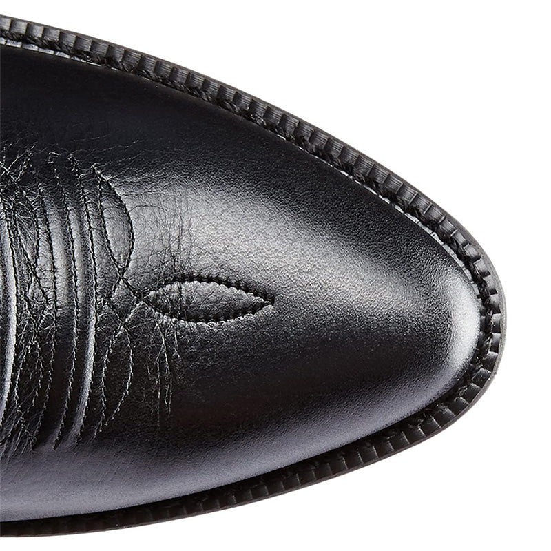 Tall embroidered cowboy boots with pointed toes and low western heels