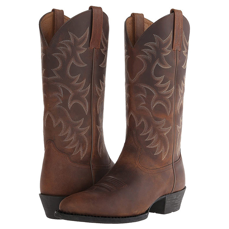 Tall embroidered cowboy boots with pointed toes and low western heels