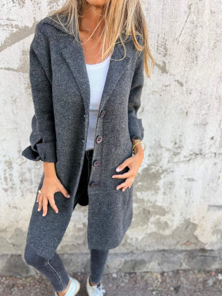 Women's oversized long coat with wide lapels, button front and cuffed sleeves