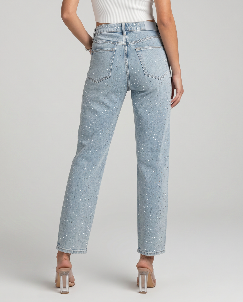 Women's light blue high-rise straight-leg jeans with reflective embellishments