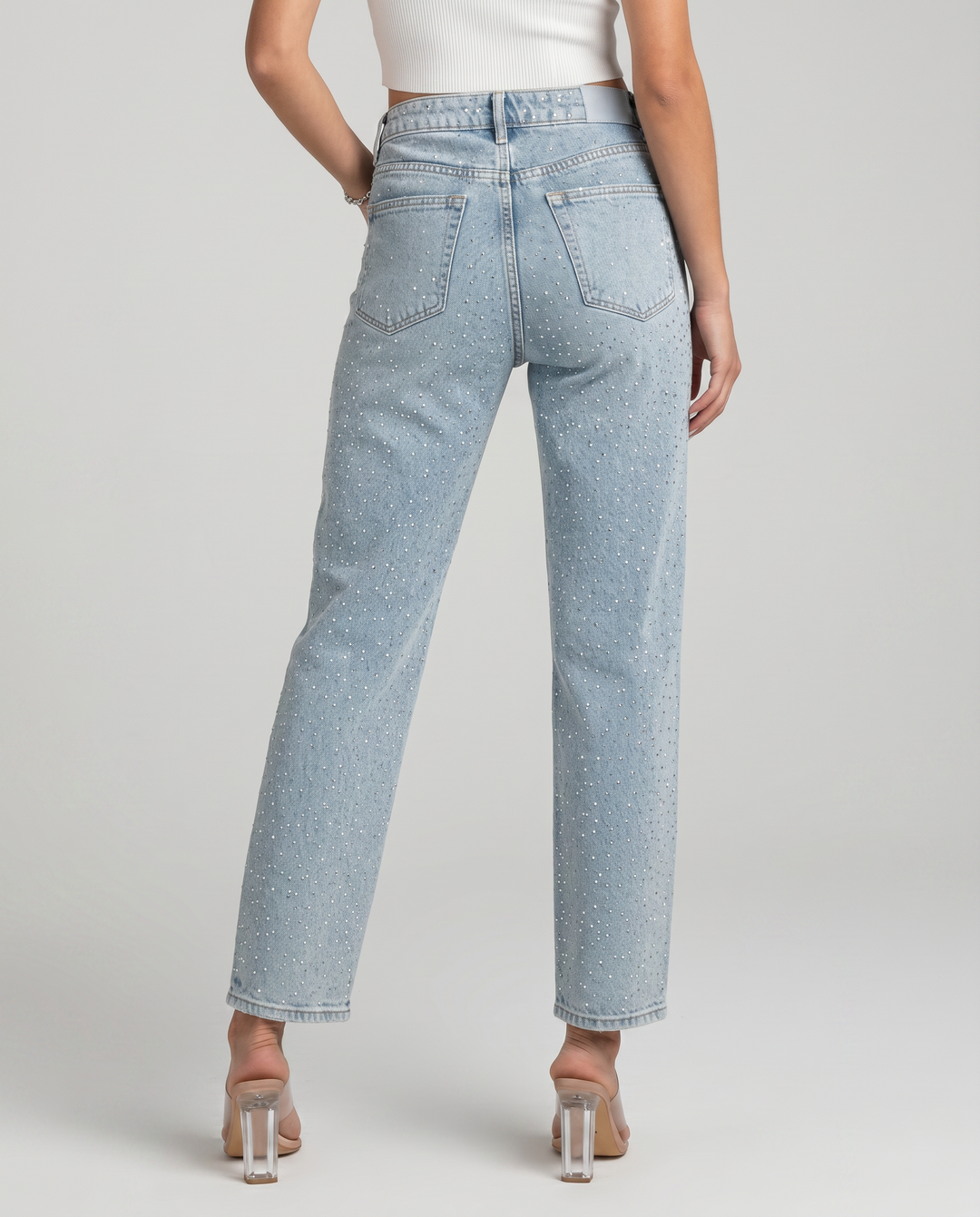 Women's light blue high-rise straight-leg jeans with reflective embellishments