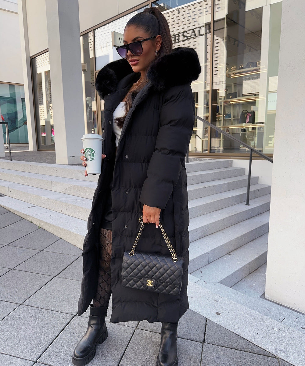 Women's black quilted puffer coat with hood, belt and long calf-length cut