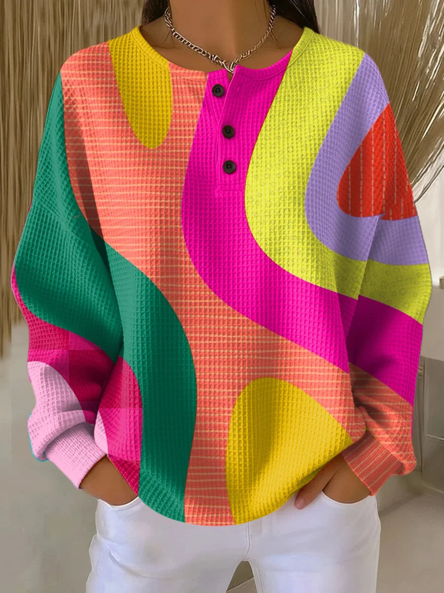 Women's multicolor geometric waffle sweatshirt with button neckline and long sleeves