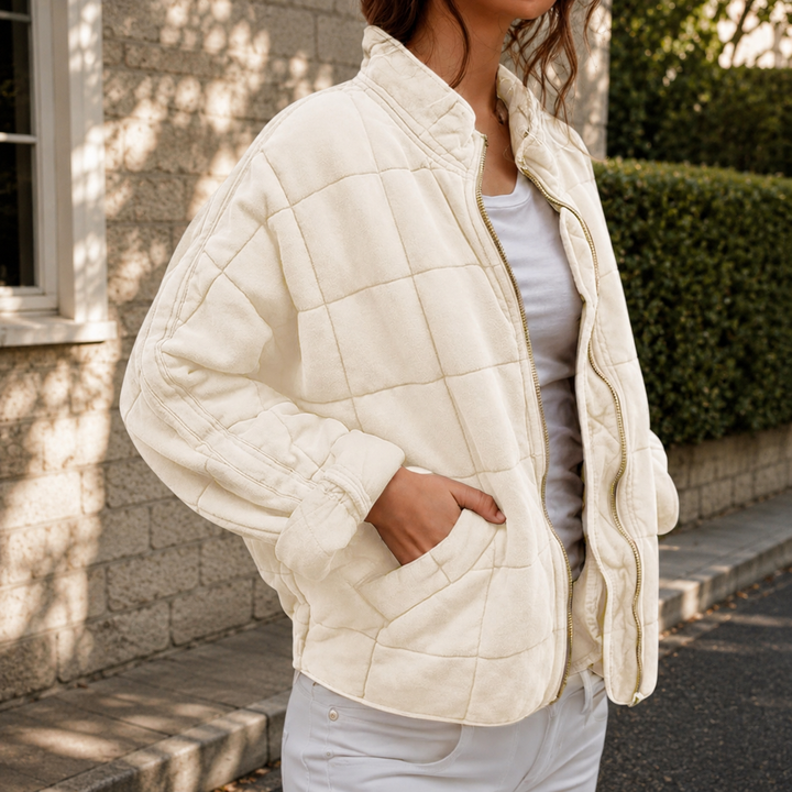 Women's relaxed quilted jacket with stand collar, long sleeves, zip front and patch pockets
