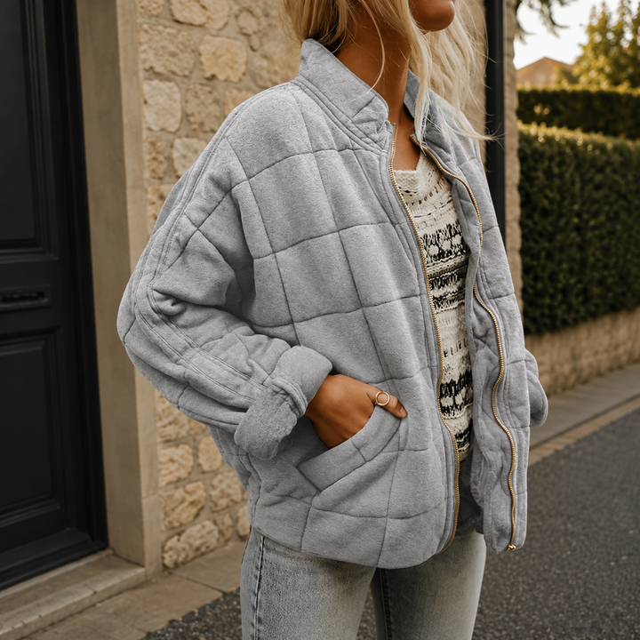 Women's relaxed quilted jacket with stand collar, long sleeves, zip front and patch pockets