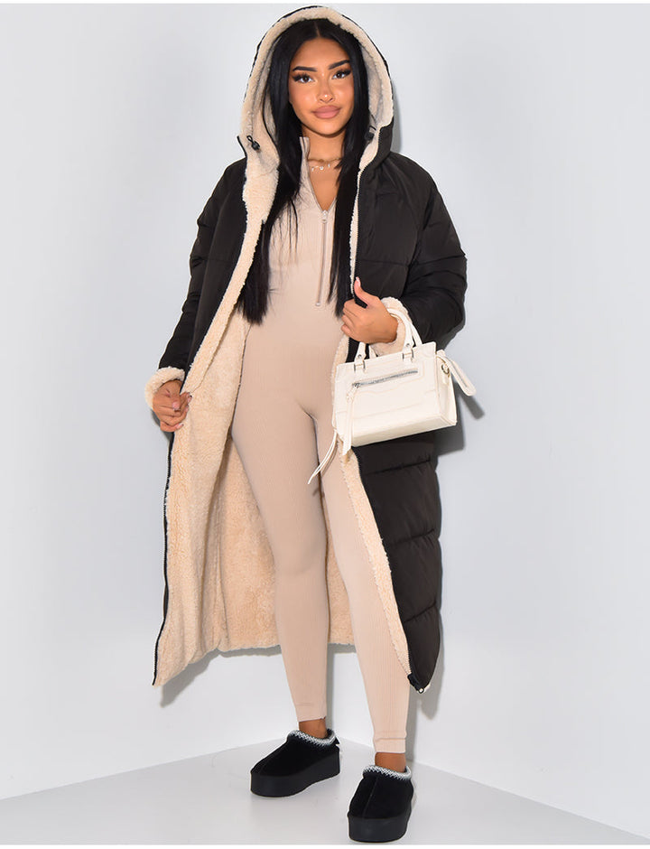 Women's long reversible hooded puffer coat shown with quilted and textured sides