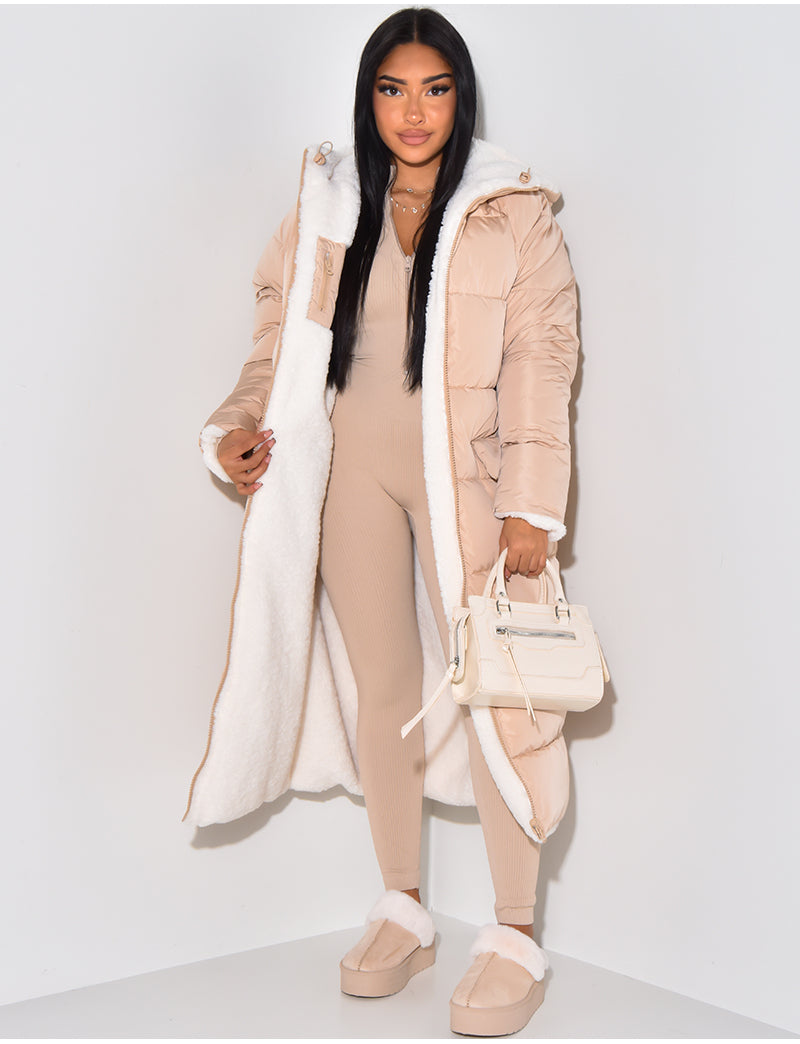 Women's long reversible hooded puffer coat shown with quilted and textured sides