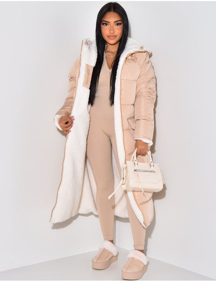Women's long reversible hooded puffer coat shown with quilted and textured sides