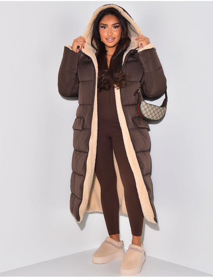 Women's long reversible hooded puffer coat shown with quilted and textured sides