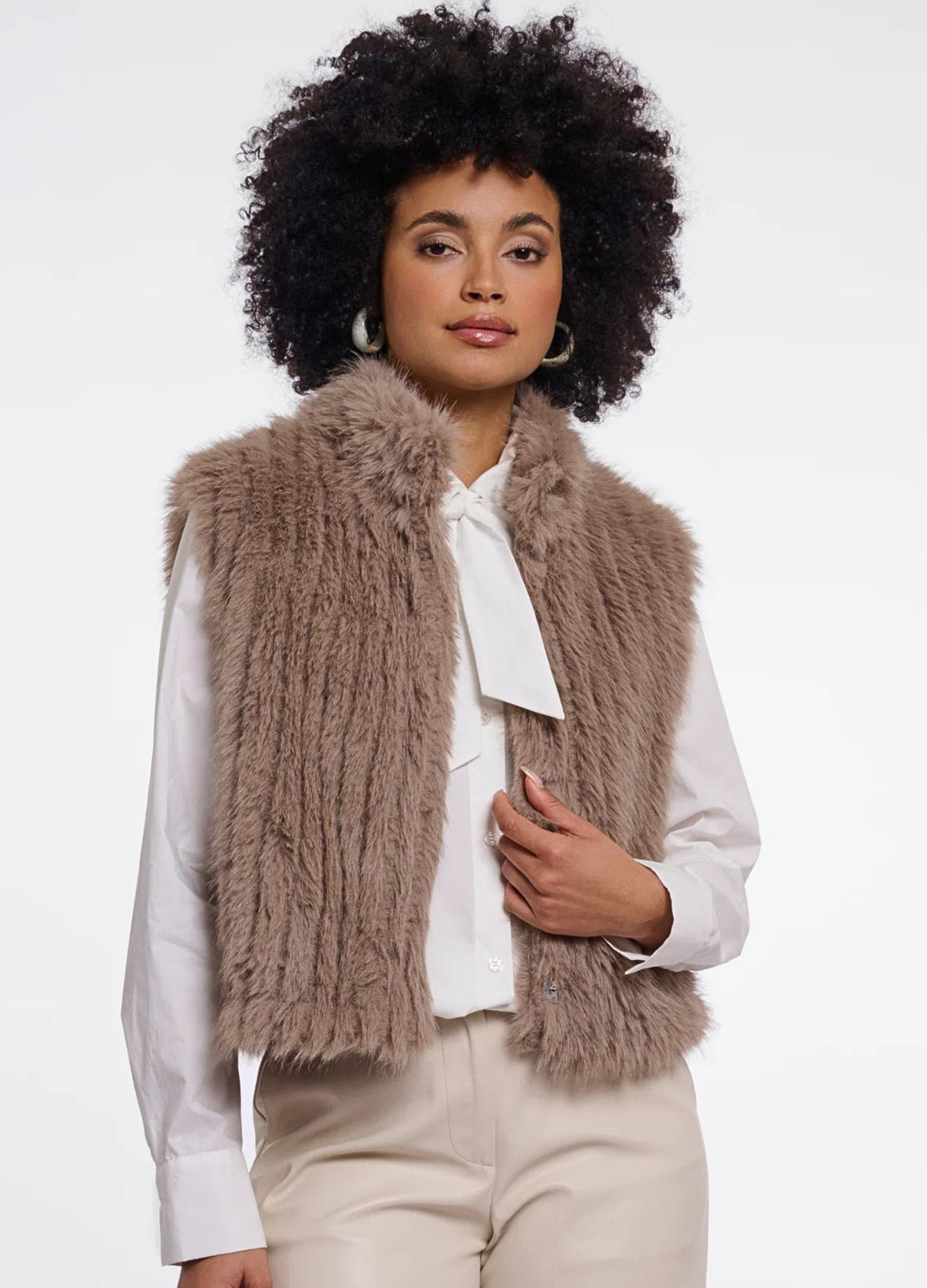 Women's brown shaggy faux fur gilet with a sleeveless cut and broad collar