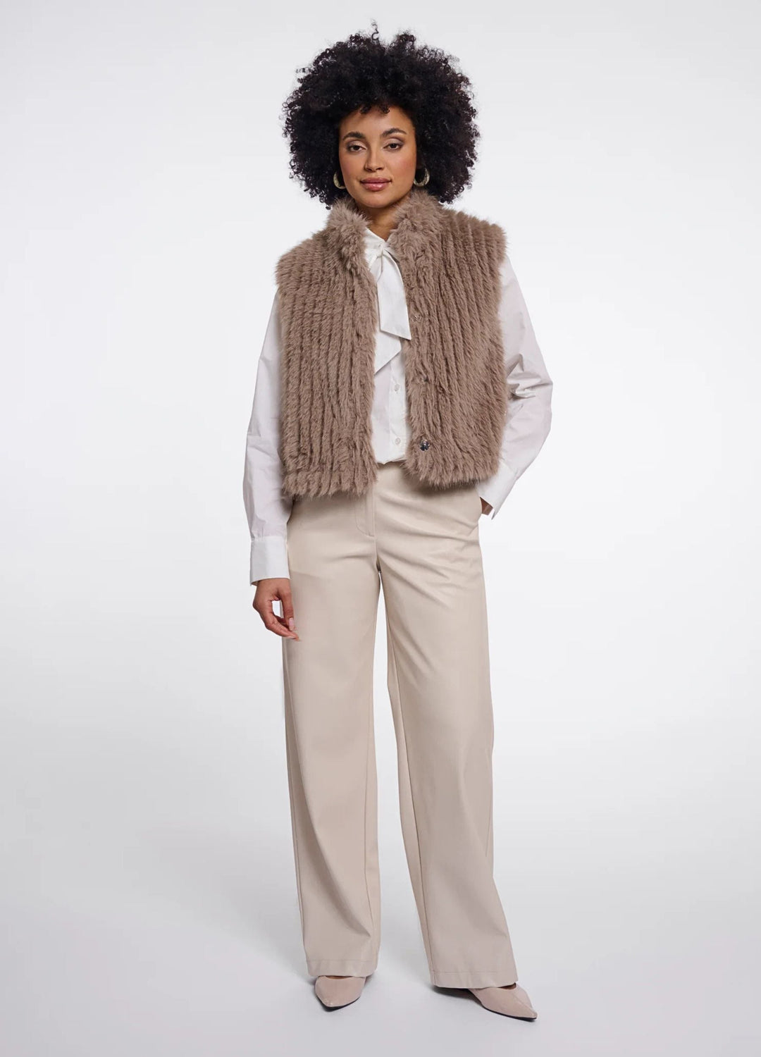 Women's brown shaggy faux fur gilet with a sleeveless cut and broad collar