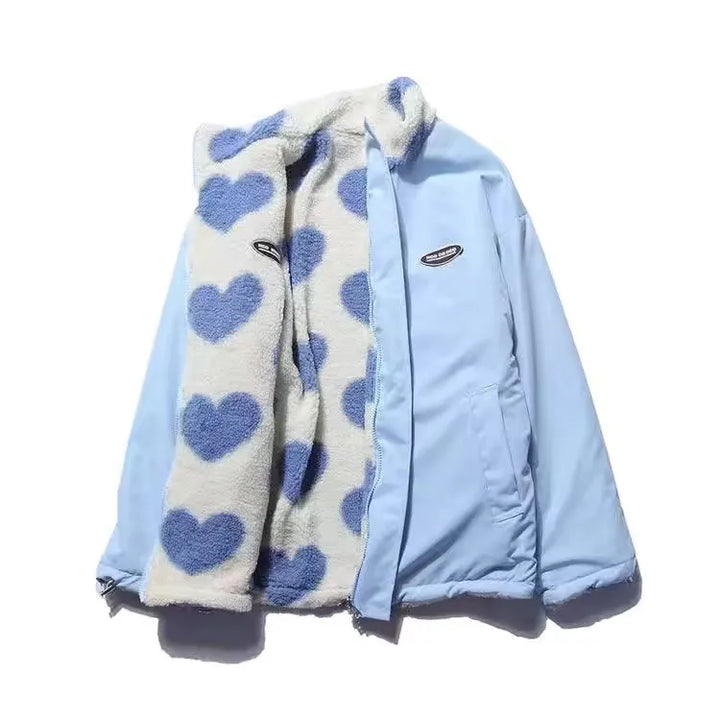 Reversible jacket with heart-patterned textured side, high collar and zip front