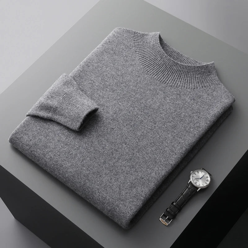 Folded solid knit sweater with ribbed crew neckline and cuffs