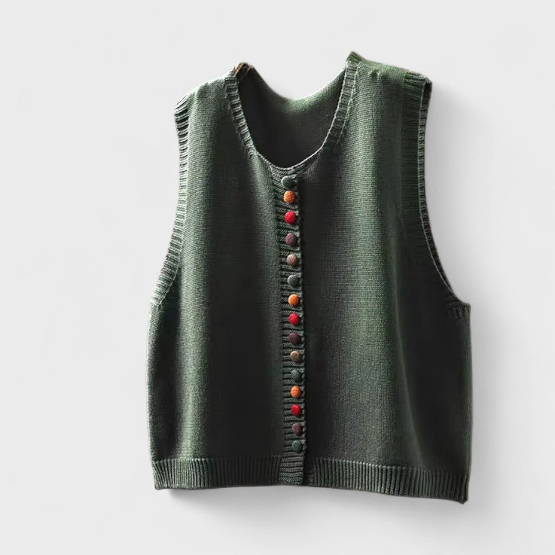 Sleeveless V-neck button front cardigan vest layered over a white collared blouse