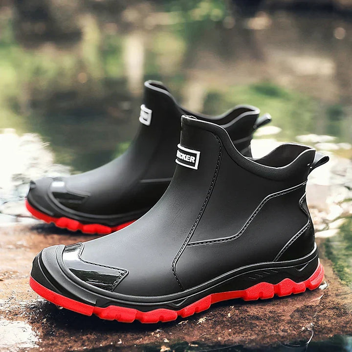 Ankle Chelsea boots with round toes, pull tabs and treaded flat soles