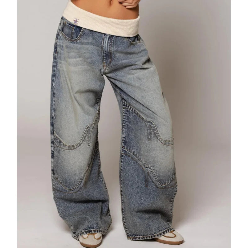 Women's light blue baggy wide leg jeans with ribbed waistband and curved panel detailing
