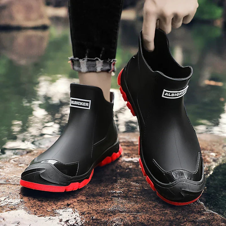 Ankle Chelsea boots with round toes, pull tabs and treaded flat soles