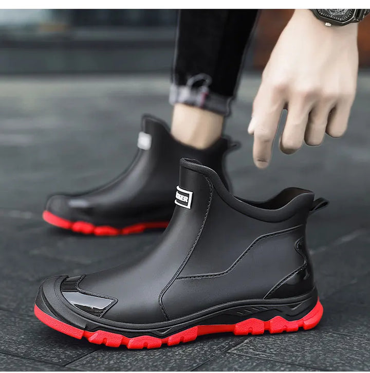 Ankle Chelsea boots with round toes, pull tabs and treaded flat soles