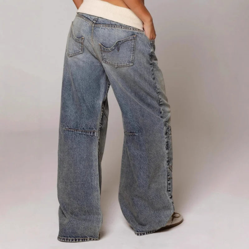 Women's blue wide-leg jeans with ribbed waistband and curved stitched panels