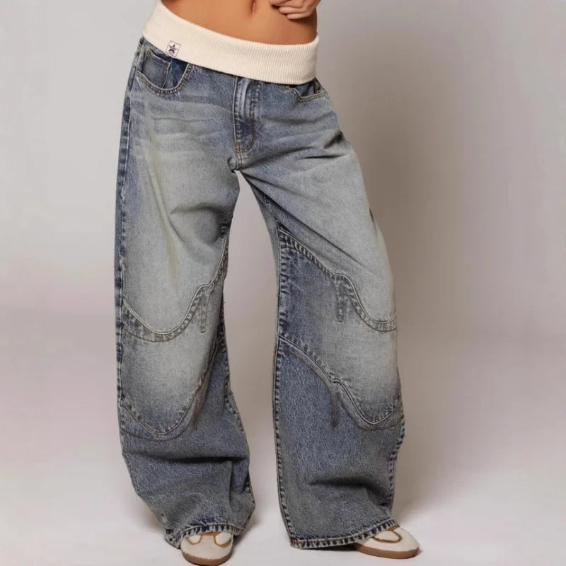 Women's light blue baggy wide leg jeans with ribbed waistband and curved panel detailing