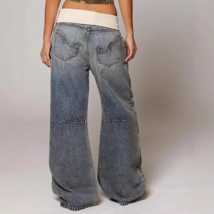Women's light blue baggy wide leg jeans with ribbed waistband and curved panel detailing