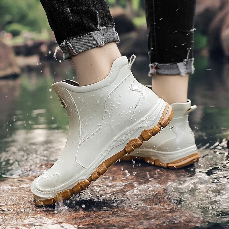 Ankle Chelsea boots with round toes, pull tabs and treaded flat soles
