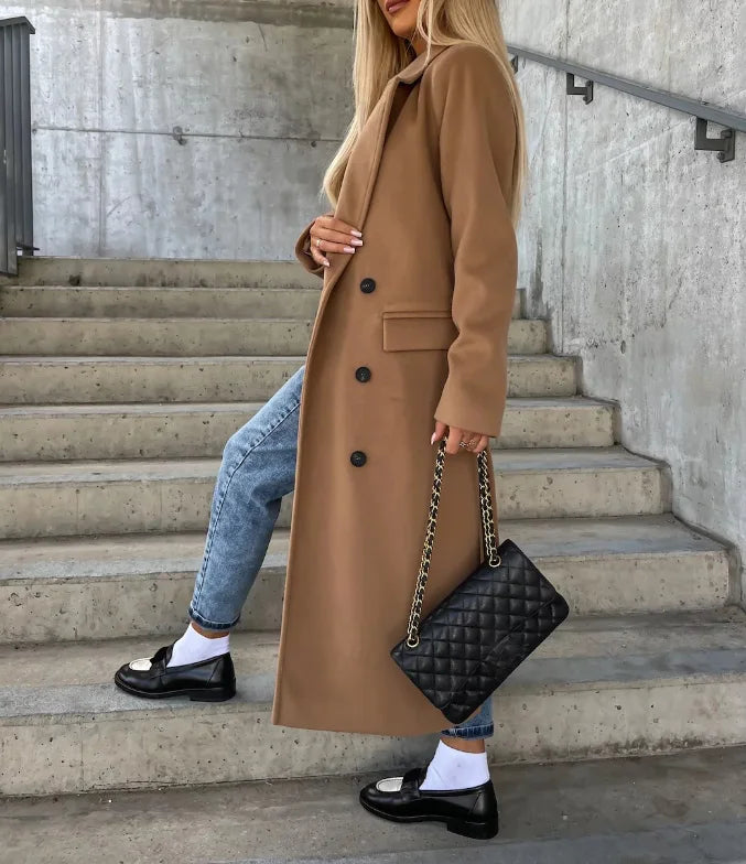 Women's long double-breasted structured coat with notched lapels, tie belt and flap pockets