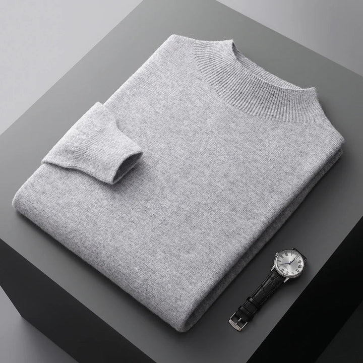 Folded solid knit sweater with ribbed crew neckline and cuffs