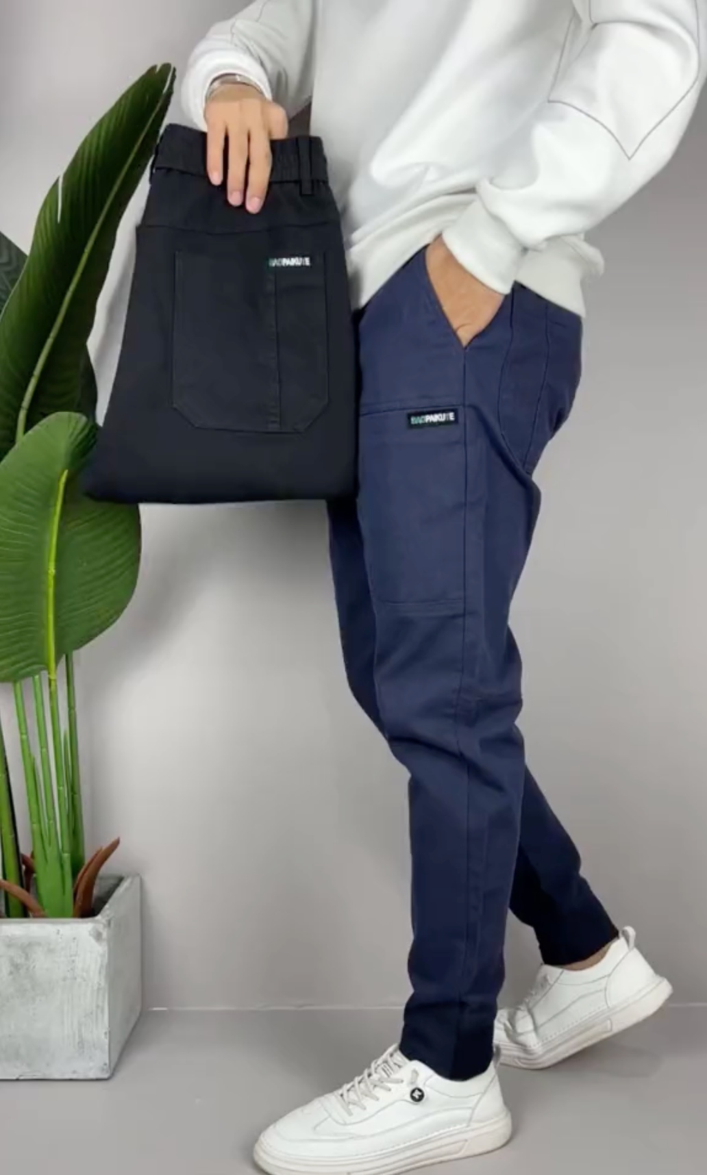 Unisex tapered cargo trousers with side pockets and ankle cuffs