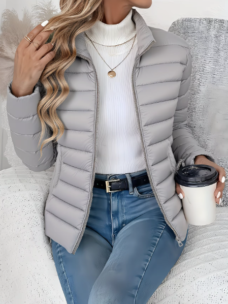 Women's quilted jacket with high stand collar, long sleeves and zip front