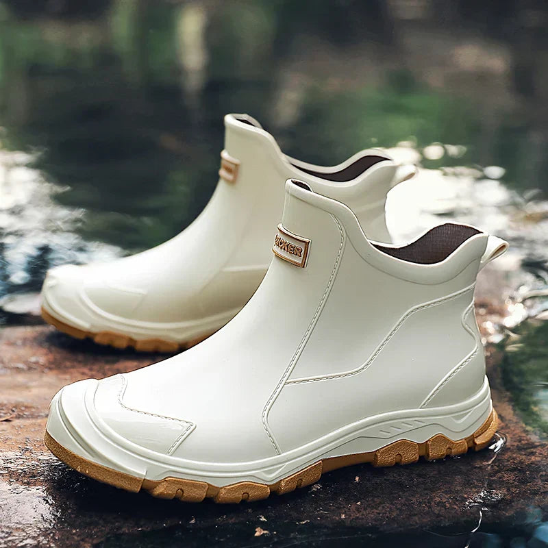 Ankle Chelsea boots with round toes, pull tabs and treaded flat soles
