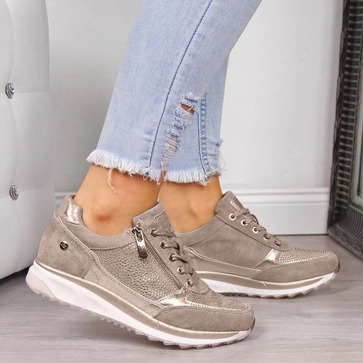 Women's low-cut lace-up sneakers with perforated panels and contrasting soles