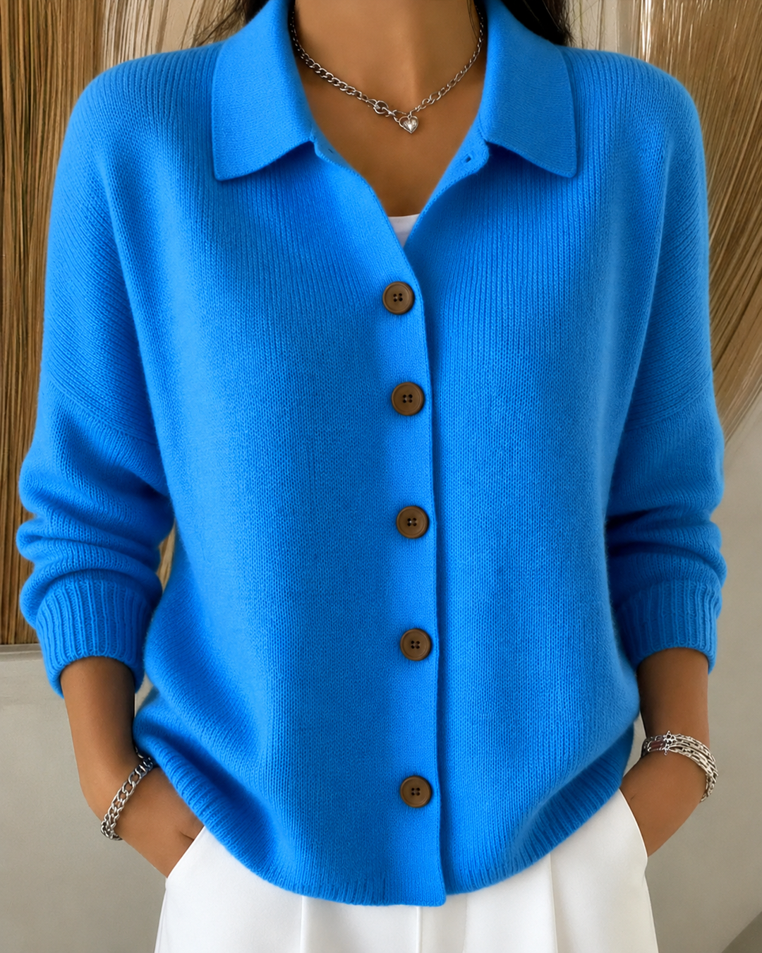 Women's collared knit cardigan with long sleeves and button front