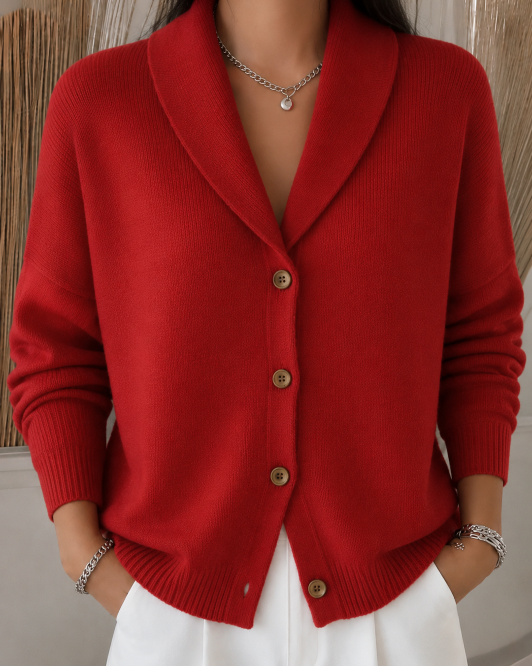 Women's collared knit cardigan with long sleeves and button front