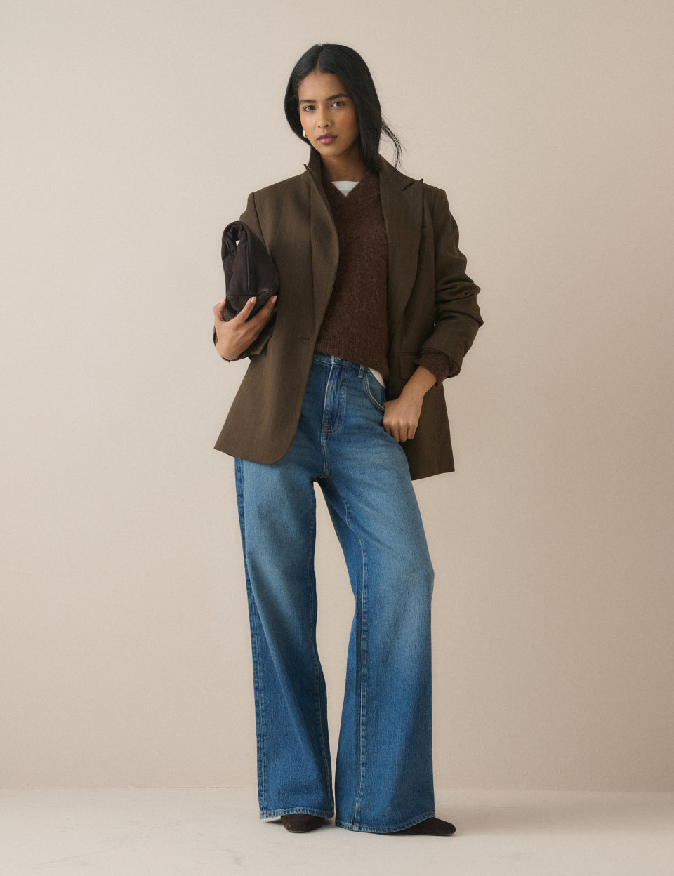 Women's mid-blue high rise wide leg jeans with full-length hems
