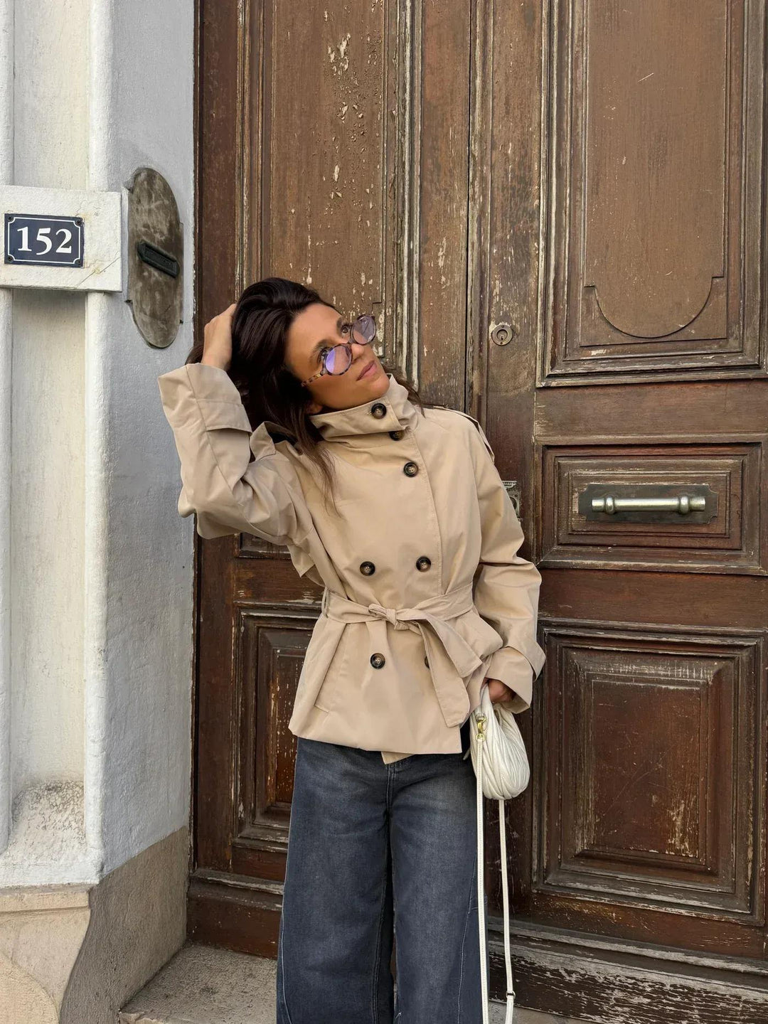 Women's belted short jacket with stand collar, long sleeves and button front