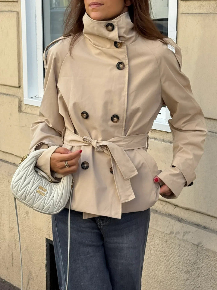 Women's belted short jacket with stand collar, long sleeves and button front